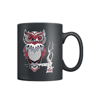 Owl Sits on a branch